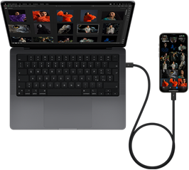 Un iPhone 15 Pro Max collegato a un MacBook Pro da 14 pollici tramite USB-C